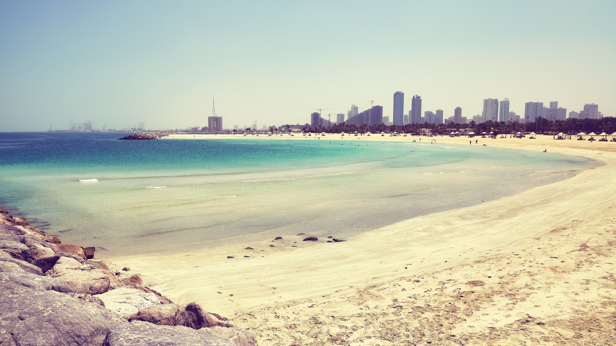 Al Mamzar Beach in Dubai, Sharjah city in distance, UAE.