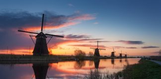 Silhouette of windmills at sunrise in Kinderdijk, Netherlands