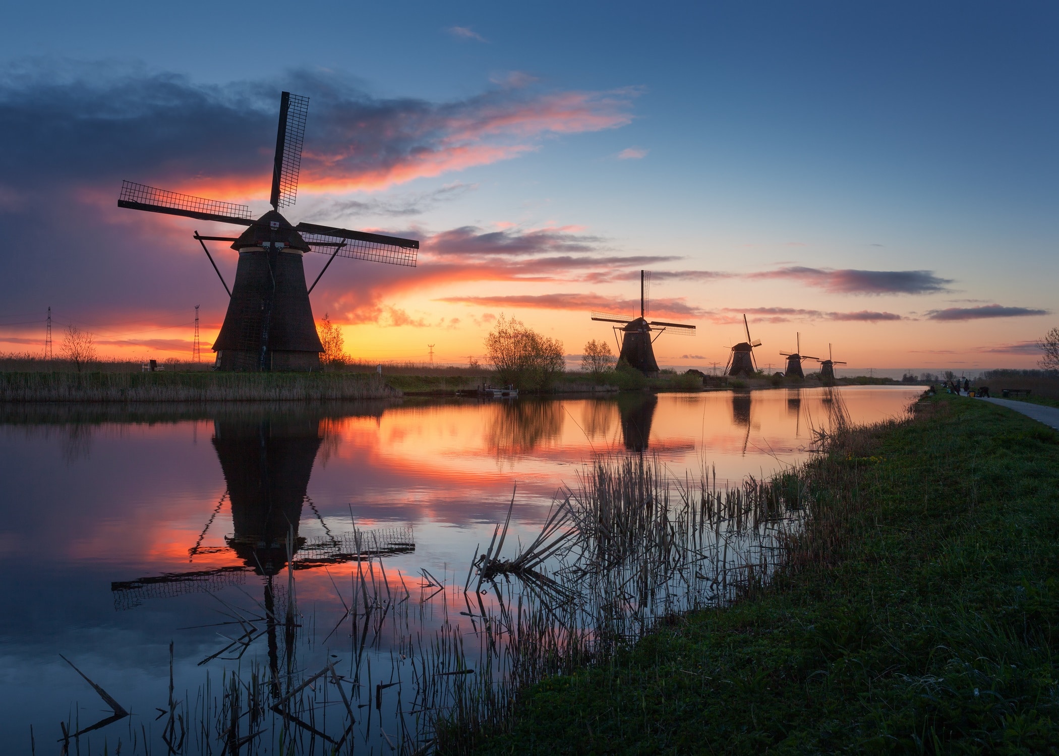 Silhouette of windmills at sunrise in Kinderdijk, Netherlands