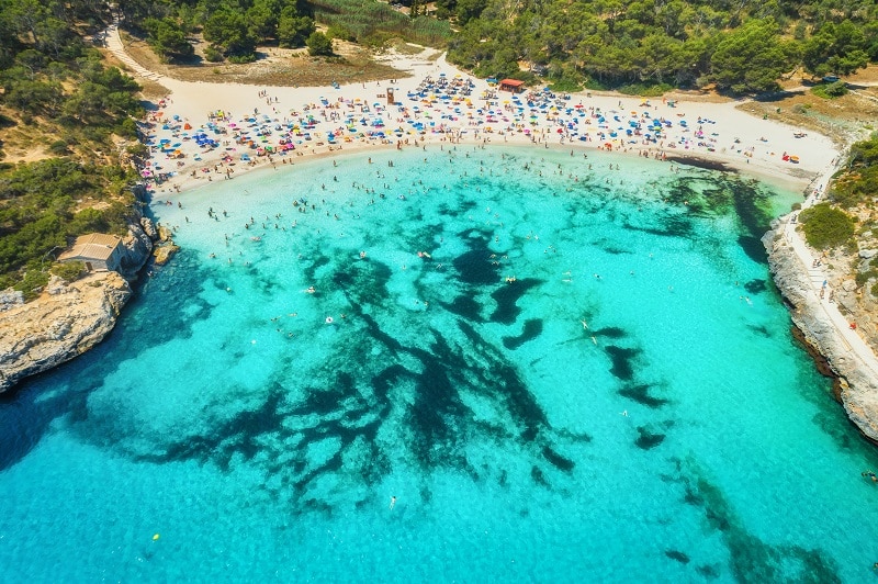 Aerial view of sea with azure water and sandy beach