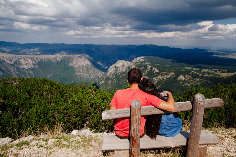 couple travel and relax in mountains