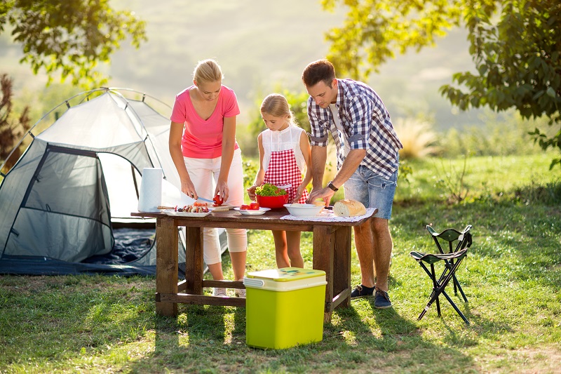 Family on vacation having barbecue