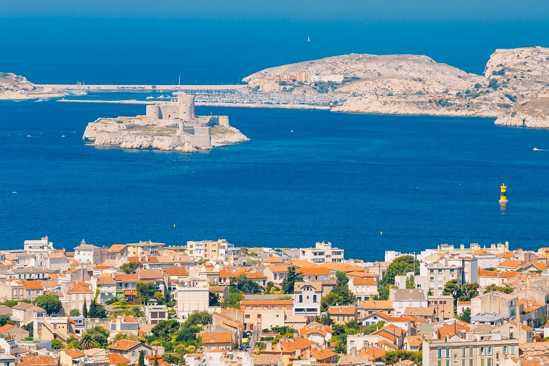 Marseille, France. Elevated view Of cityscape and If Castle in Marseilles, France. Sunny summer day with bright blue sky