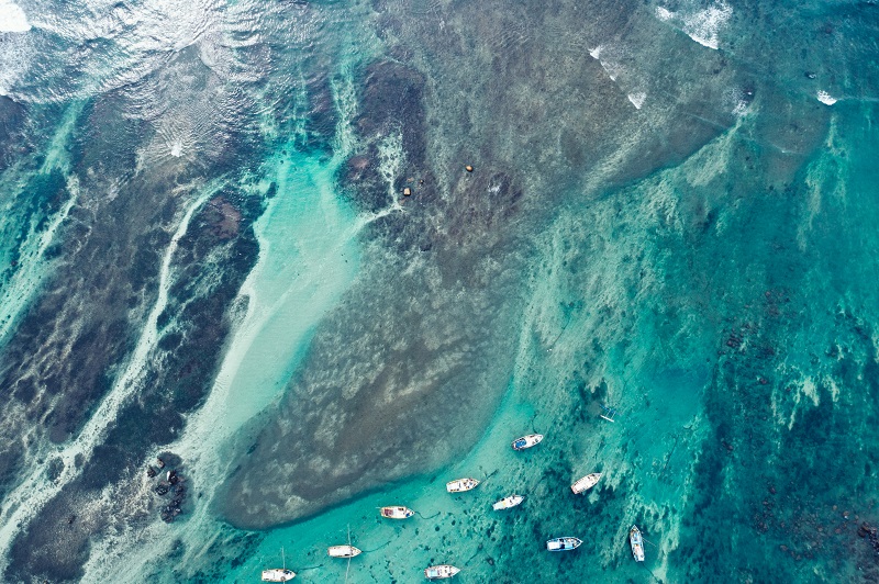 Aerial view of beautiful seascape with fishing boats in the coast