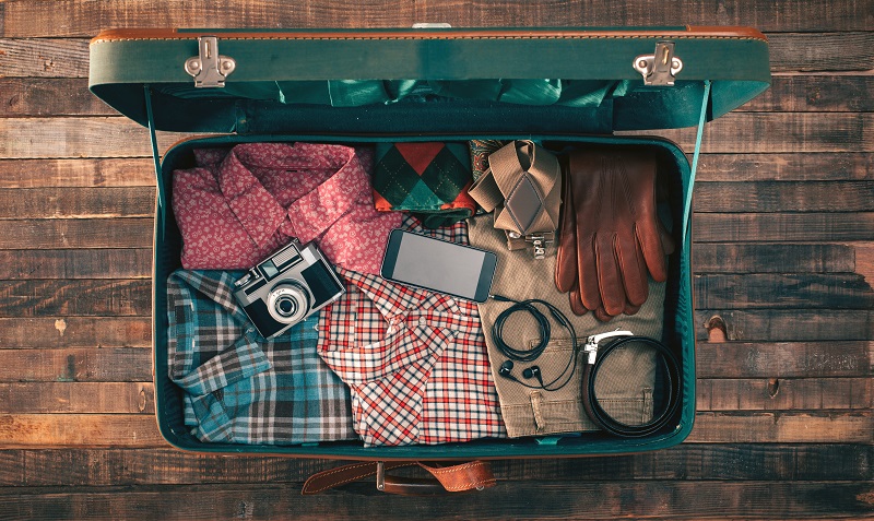 Hipster traveler packing