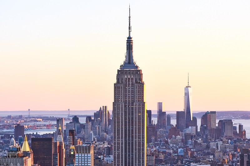 Cityscape view of Manhattan with Empire State Building at sunset