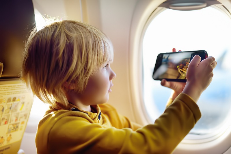 little-boy-is-taking-a-shot-view-of-airfield-from