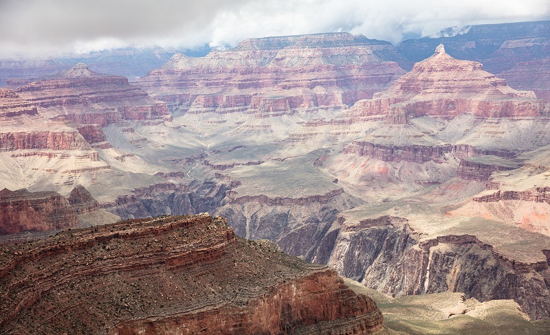 Grand Canyon, Arizona, USA. Overlook of the red rocks, cloudy sky background