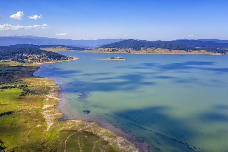 Scenic aerial view with a drone of an amazing Batak dam, Bulgaria with crystal water