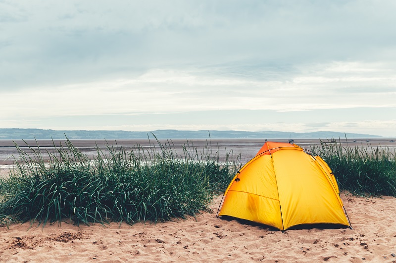 Bright Yellow Tent on the Beach