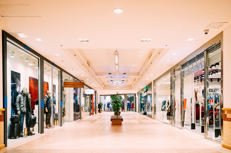 Shops with clothes at the modern shopping mall Shopping Centre.