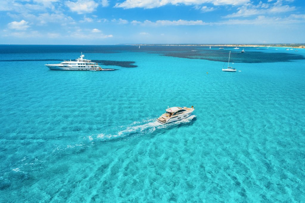 Yacht on the azure seashore in balearic islands