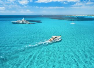 Yacht on the azure seashore in balearic islands