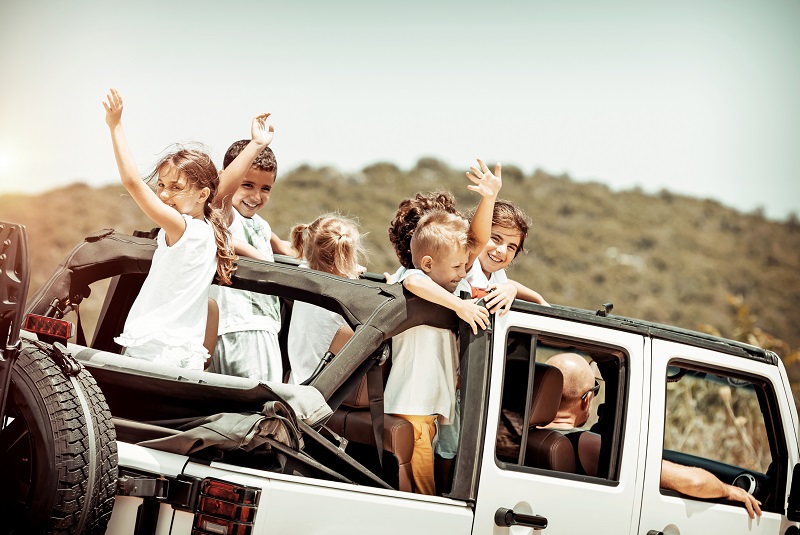 Happy kids enjoying road trip