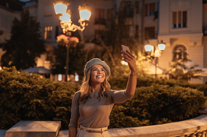 Taking a photo for her travel blog