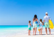 Young family on vacation on the beach. Family travel concept
