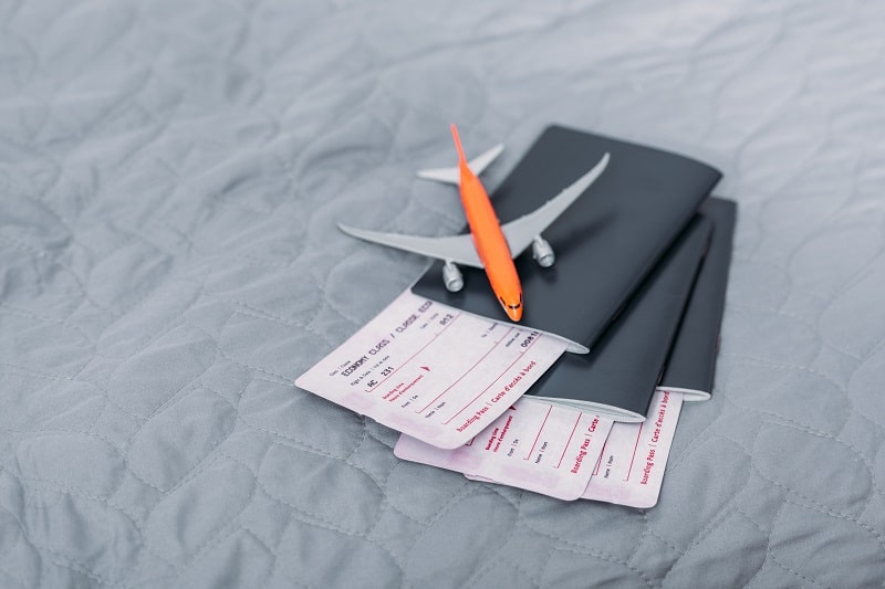 composition of flight tickets with toy airplane