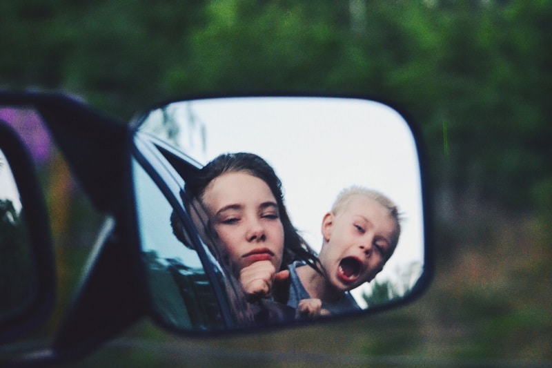 kids-fooling-around-on-a-road-trip