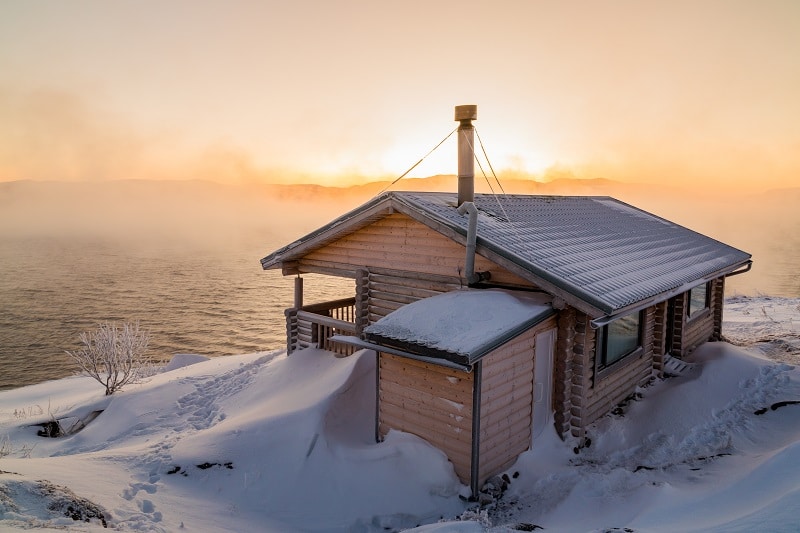 Wooden house on the beach in winter
