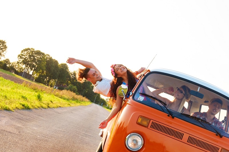 Hippie friends in a van on a road trip