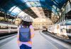 young-black-woman-traveler-with-backpack-and-hat-a