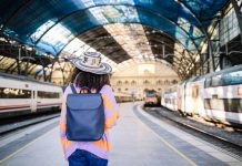 young-black-woman-traveler-with-backpack-and-hat-a