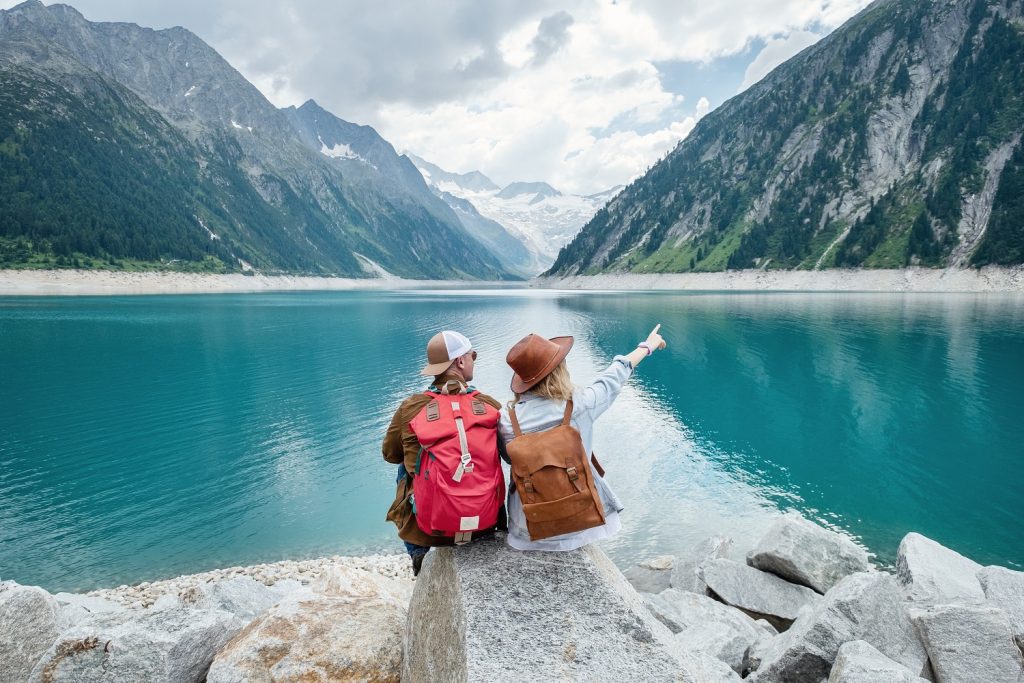 a-team-of-travelers-looking-at-the-lake-in-austria