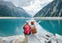 a-team-of-travelers-looking-at-the-lake-in-austria