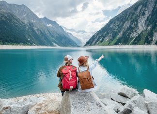 a-team-of-travelers-looking-at-the-lake-in-austria